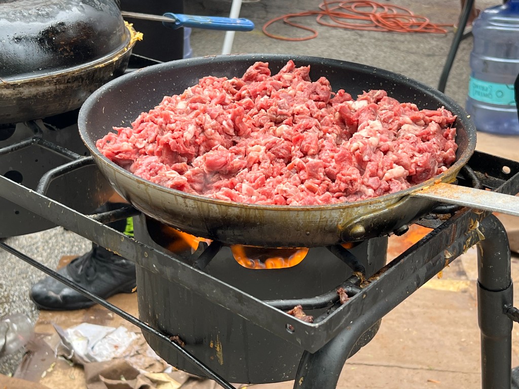 Guests lined up and enjoying the outdoor summer festival