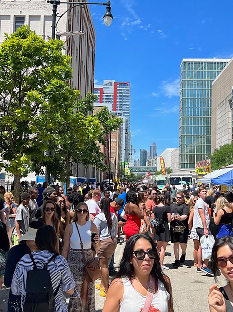 Crowds walking the South Loop street festival on a summer day