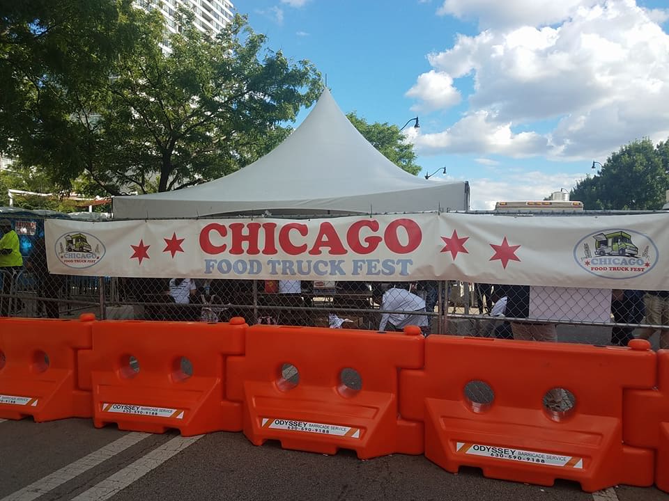Chicago Food Truck Festival banner and fenced festival entrance
