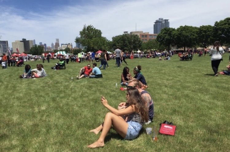 Loaded Cajun fries with shrimp, gravy, and green onions in front of a seafood food truck