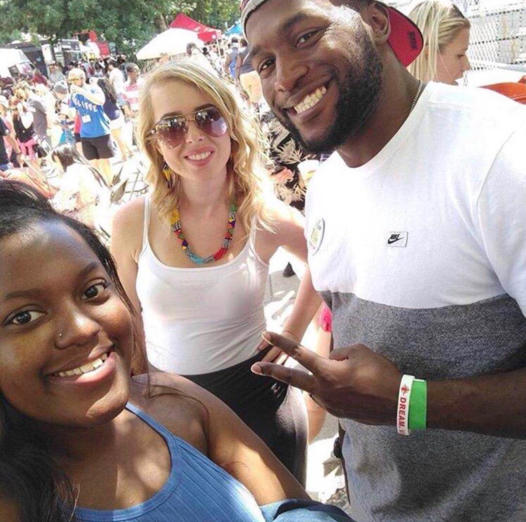 Guests in summer clothes enjoying street food and community atmosphere downtown