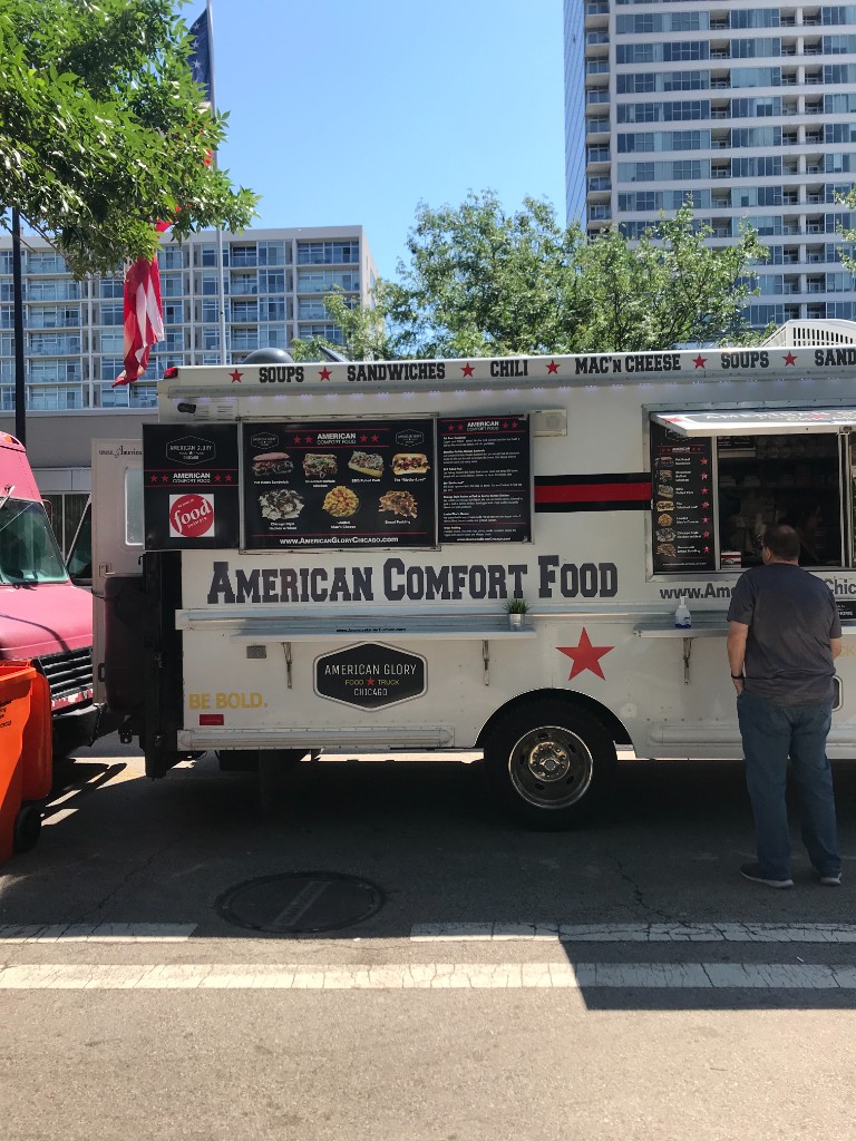 South Loop summer festival scene with food trucks and guests