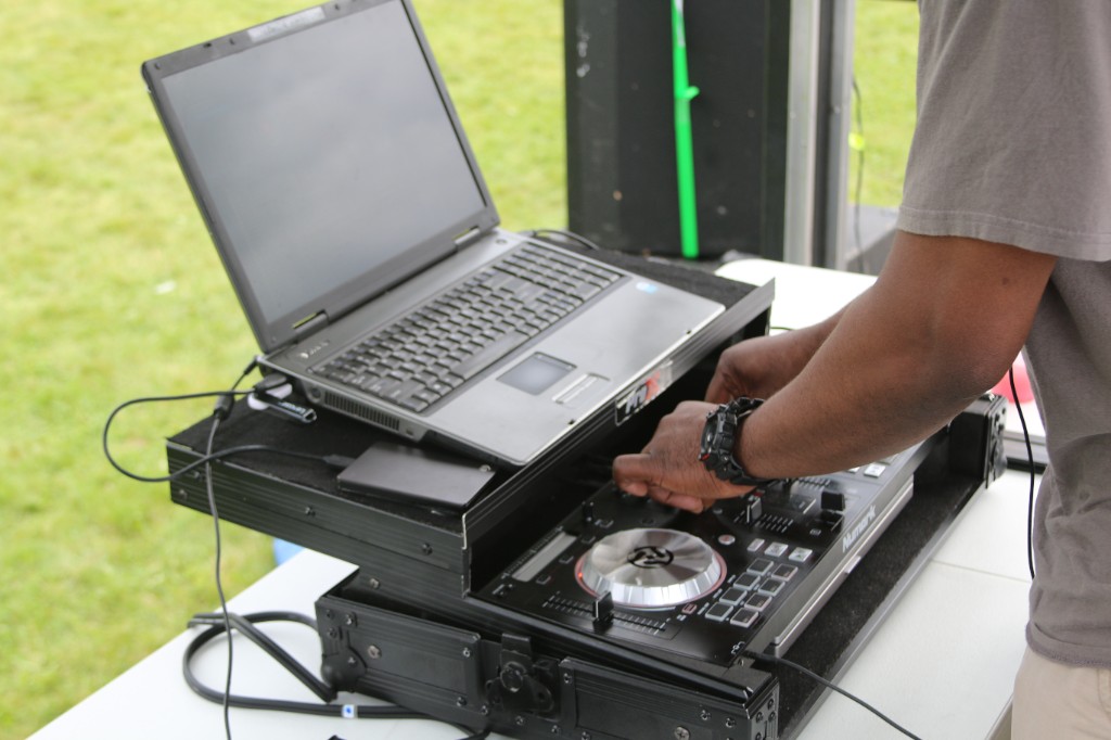 DJ performing on Numark gear at the outdoor festival