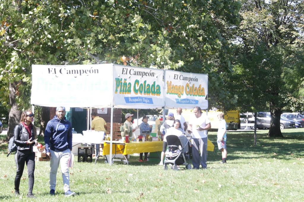 Vendor team working a booth at the Labagh Woods Fall Festival.