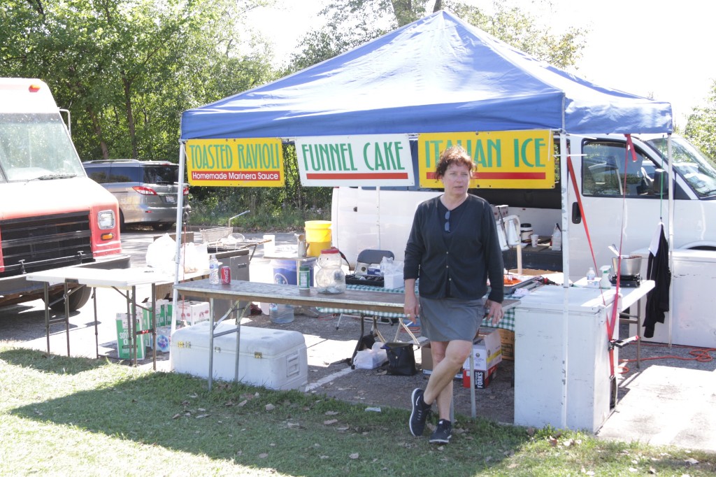 Food truck service window and nearby guests at Labagh Woods.