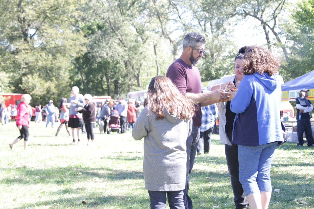Festival activity among trees at the Labagh Woods Fall Festival.