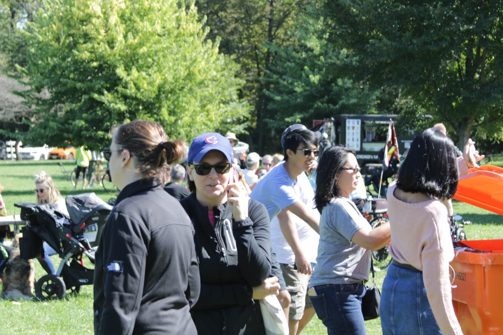 DJ on an outdoor stage with speakers at the Labagh Woods Fall Festival.