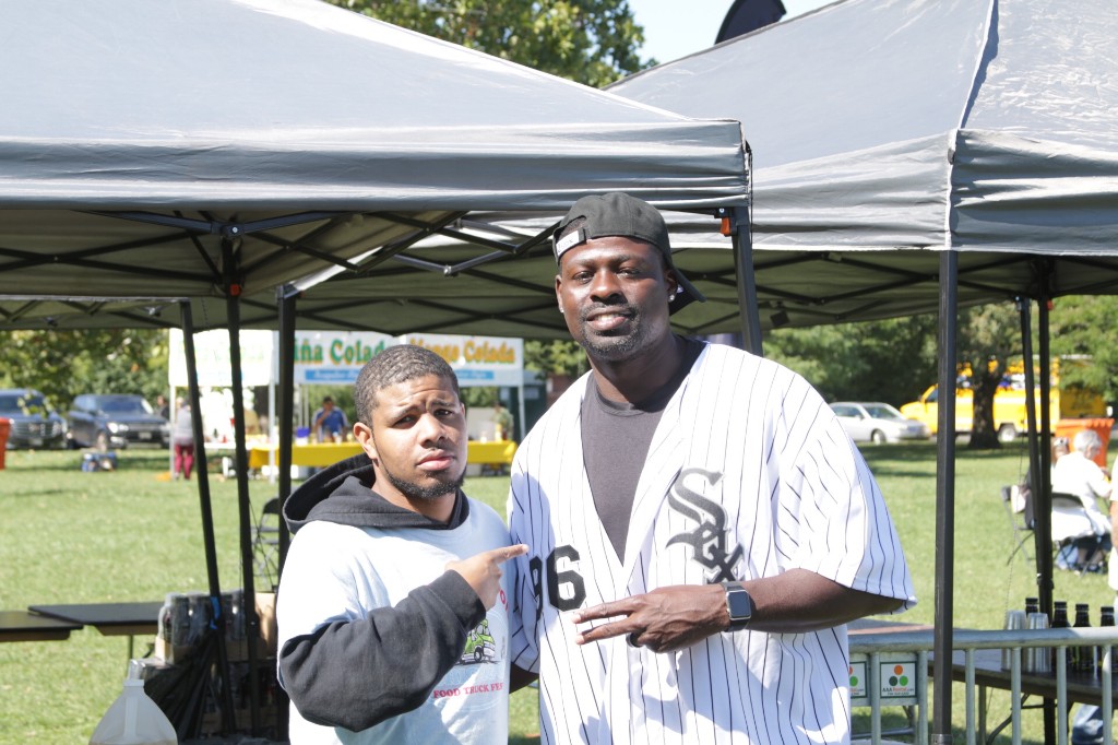 Vendor pouring batter at a festival fry station with steam at Labagh Woods.