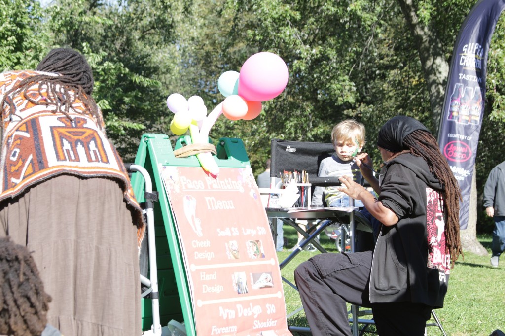 Chicago's 1st T-Shirt Truck chalkboard sign and truck at the Labagh Woods festival.