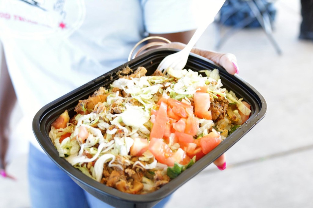 Loaded takeout bowl with lettuce, tomato, and seasoned meat at the Labagh Woods Fall Festival.