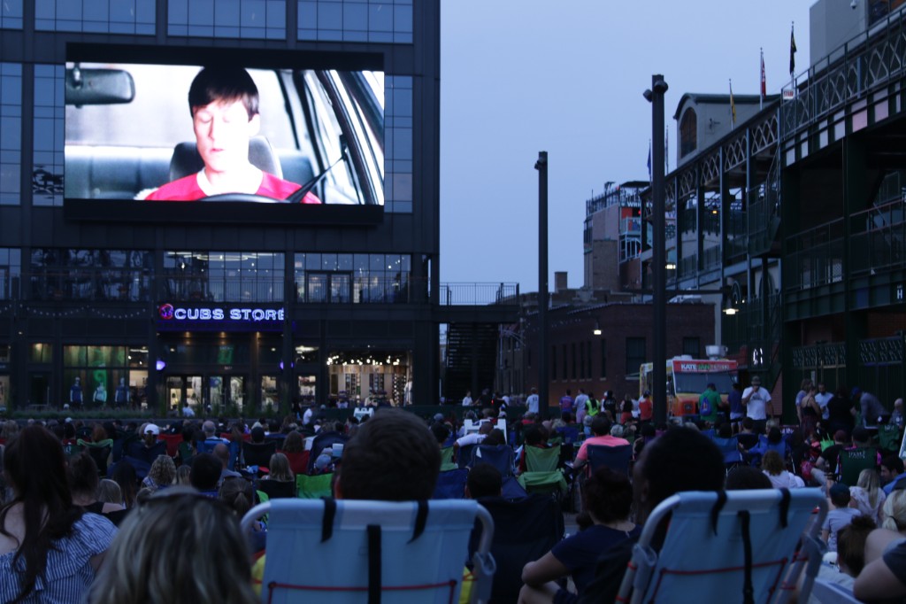 Crowds and food trucks on Gallagher Way outside Wrigley Field
