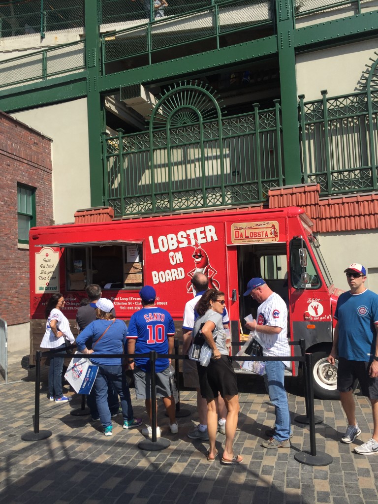 Chicago Food Truck Festival digital board listing vendors at Wrigley Field