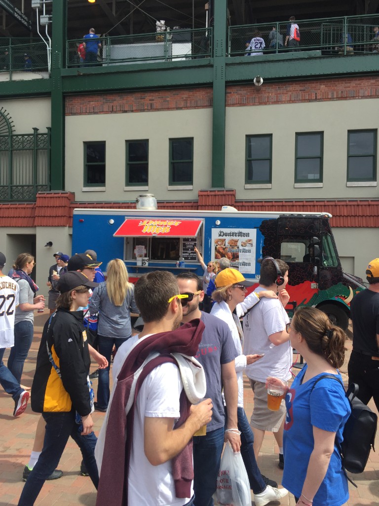 Kate & Jan Hotdogs truck beside Wrigley Field architecture