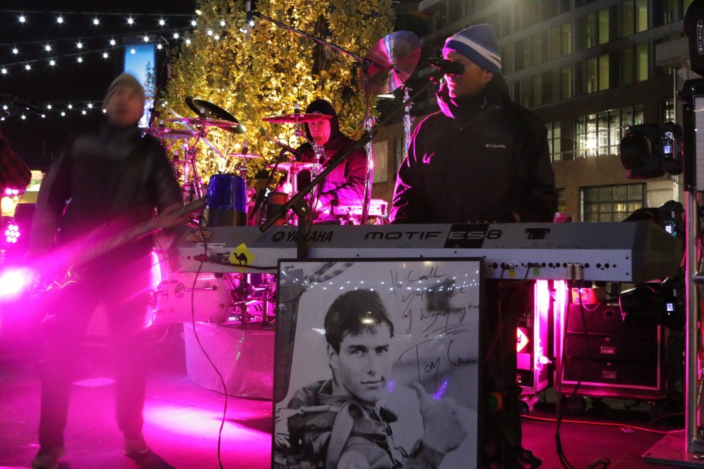 Elevated view of string lights, food trucks, and guests outside Wrigley Field