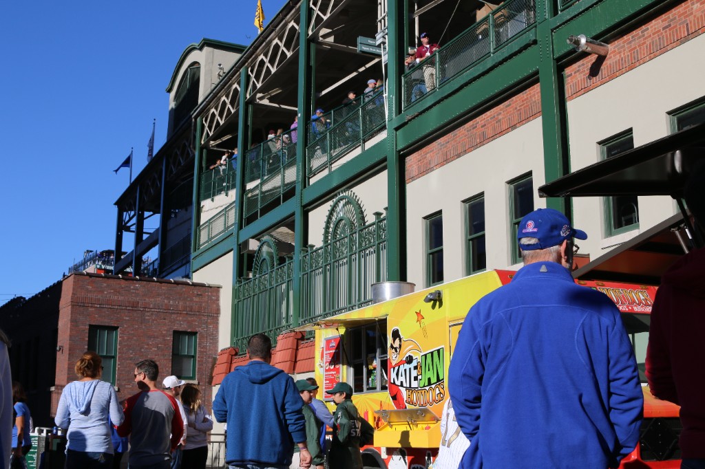 Kate & Jan Hotdogs truck parked outside Wrigley Field on a sunny game day